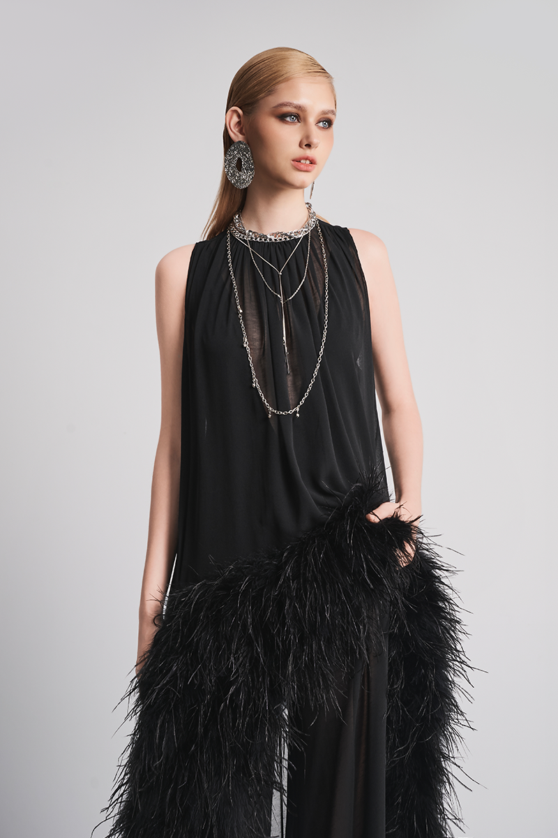 Black Nocturnal Warmth jumpsuit by Le Thanh Hoa, featuring a sleek, comfortable design with a fitted silhouette and modern style.