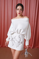 Ivory Grace mini dress by Do Long, sleeveless short dress with a fitted bodice and flared skirt, perfect for summer wear.