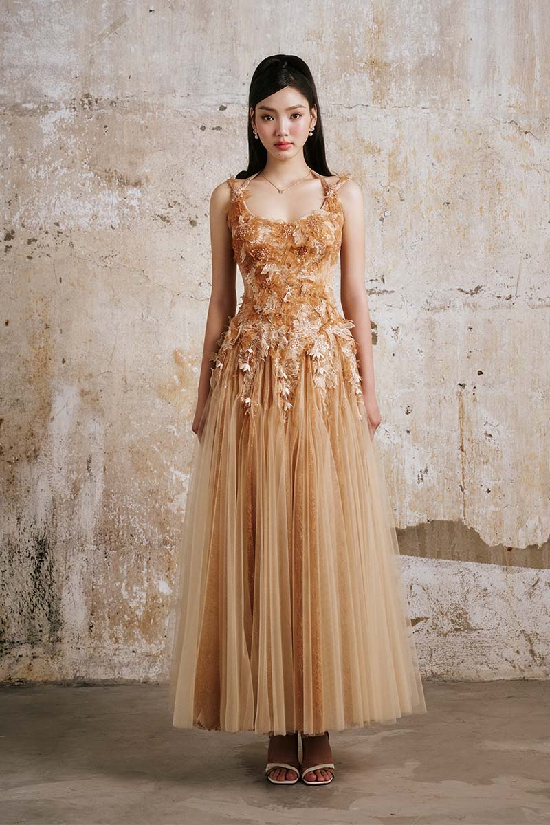Do Long CULT MIA X DO Long golden petal gown featuring flowing fabric and intricate floral details, elegant evening wear.