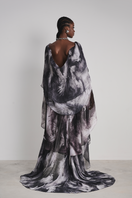 Black Le Thanh Hoa Soaring Doves maxi dress with flowing fabric and elegant design, displayed on a mannequin.