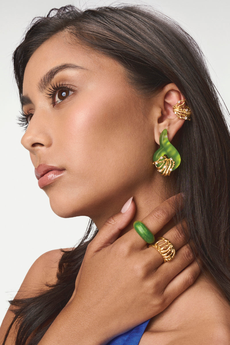 Gold vault-shaped earcuff earrings by Jude Benhalim, featuring sleek, modern jewelry design on a white background.