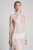 White Glacial Grace gown by Le Thanh Hoa featuring elegant fabric and flowing design, ideal for formal occasions.