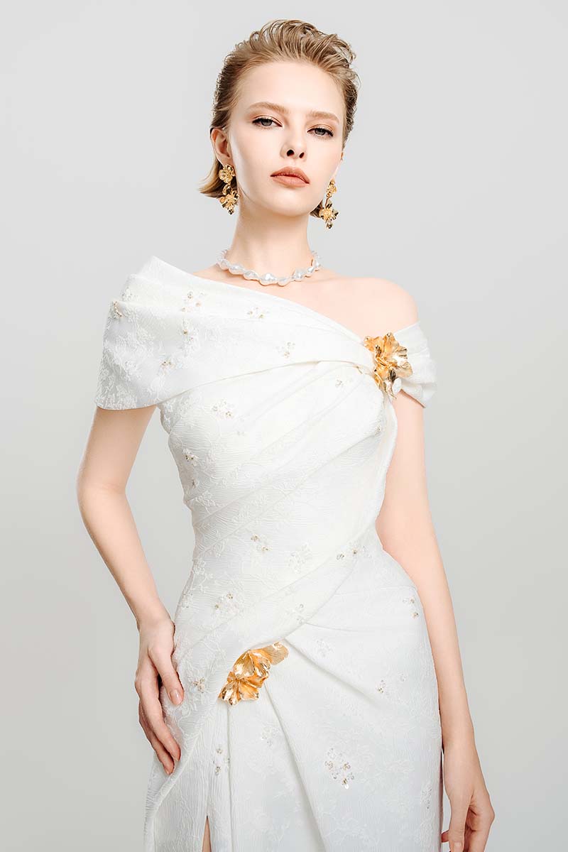 Do Long floral line maxi dress showing a flowy gown with a colorful floral pattern and elegant sleeveless design.