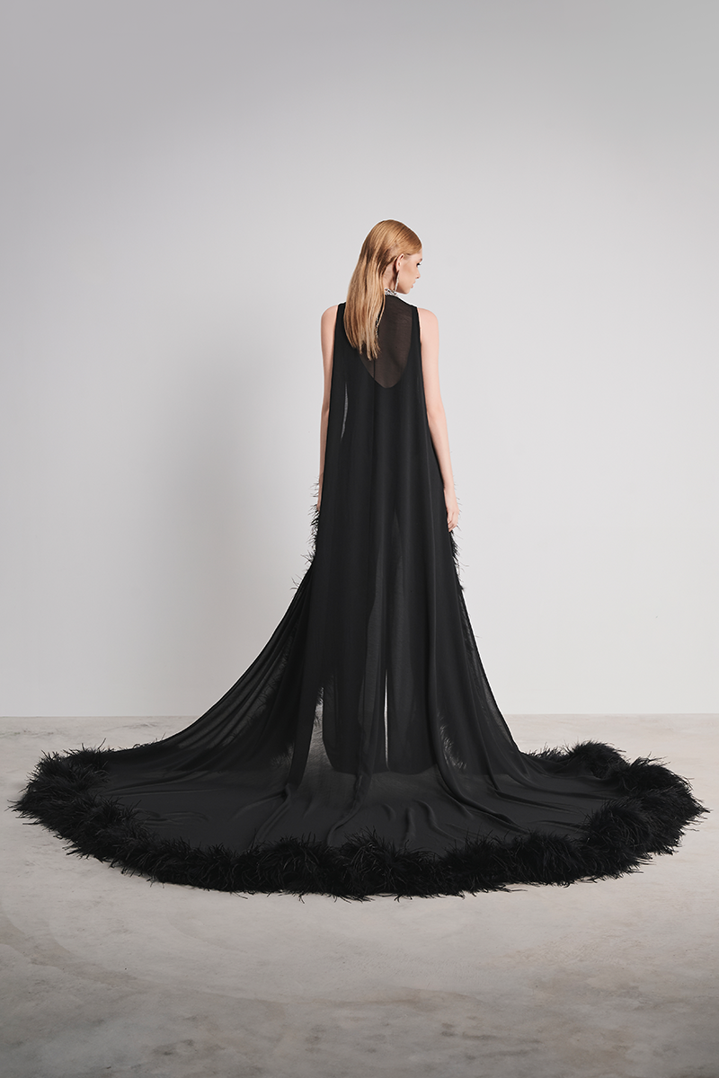 Black nocturnal warmth jumpsuit by Le Thanh Hoa, featuring a comfortable, stylish design with long sleeves and a relaxed fit.