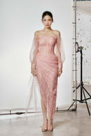 Do Long CULT MIA X DO Long Veil of Dawn gown, elegant evening dress with intricate detailing and flowing fabric.