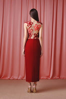 Elegant red Regal Rouge gown by Do Long, featuring flowing fabric and intricate detailing for formal occasions.