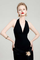 Black mystery midi dress by Do Long, showcasing a stylish midi dress with elegant design and flowing fabric.