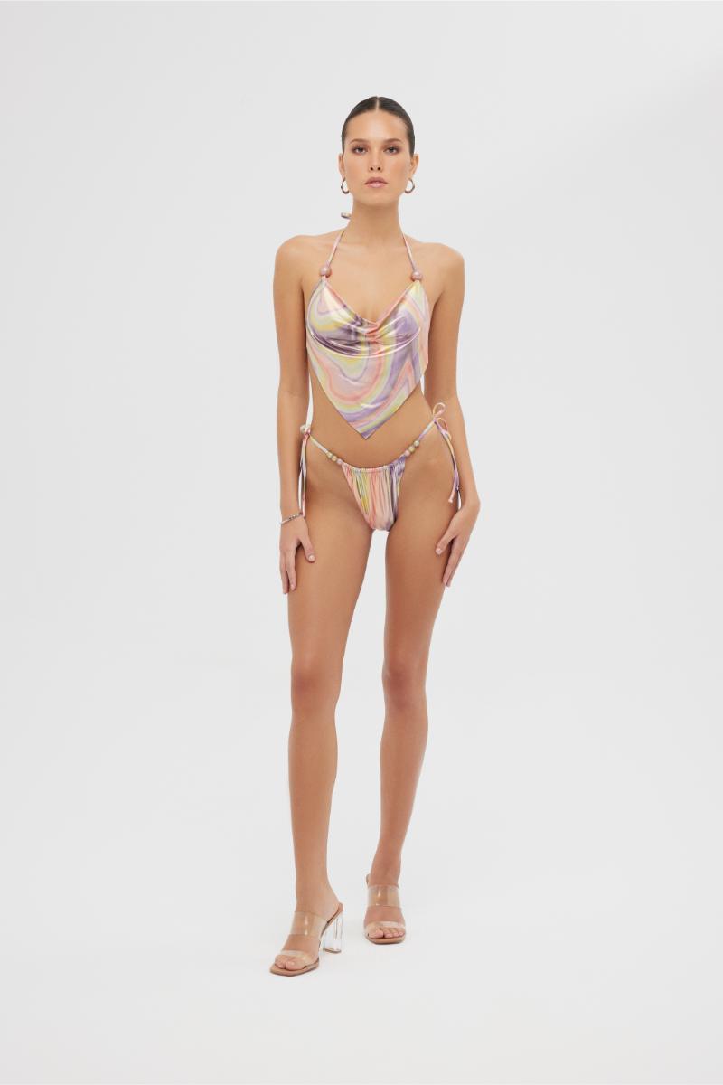 Shiny pink Aruna bikini set by Maliluha featuring a stylish print and adjustable straps on a model.