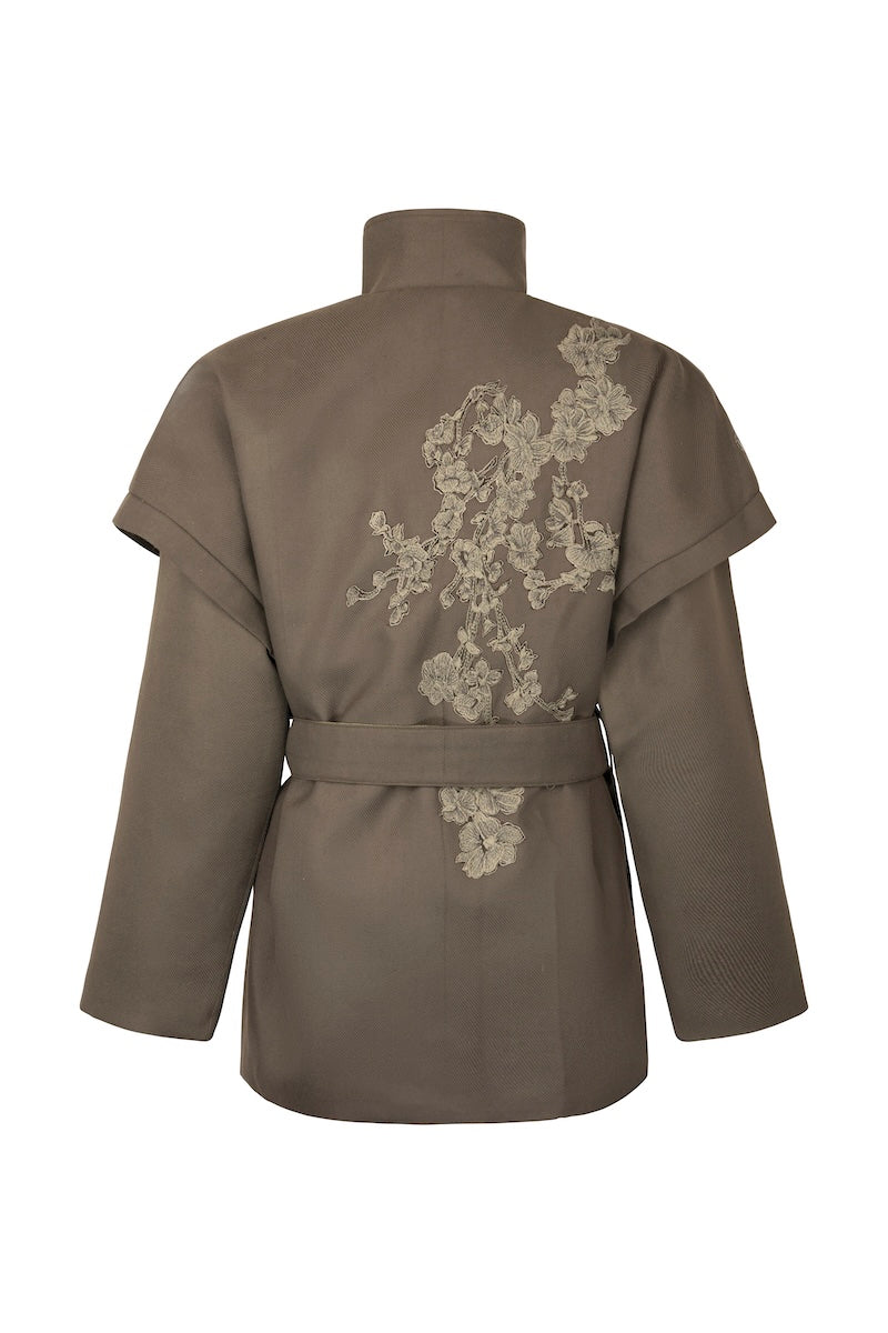 Nadya Shah Ash Bloom belted jacket with a stylish design, shown from the back featuring a fitted silhouette and belt detail.
