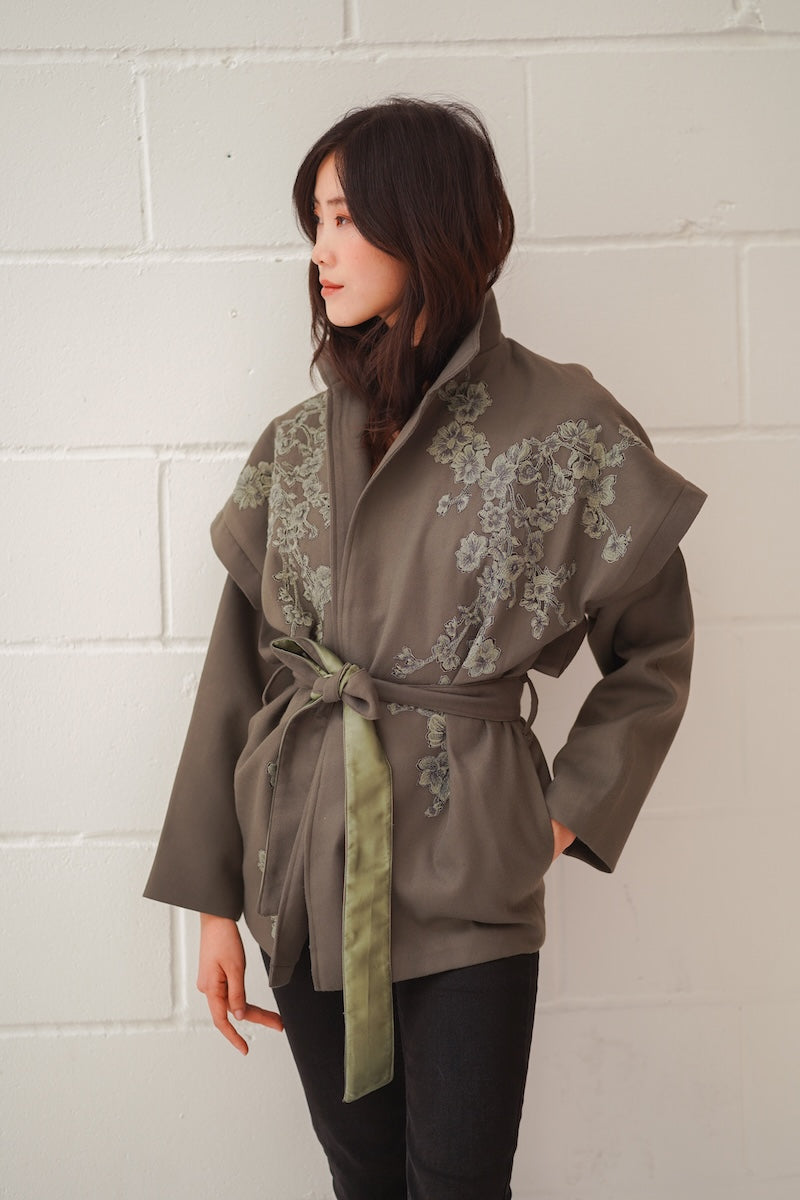 Nadya Shah Ash Bloom belted jacket featuring a stylish design and belt detail, displayed on a mannequin.