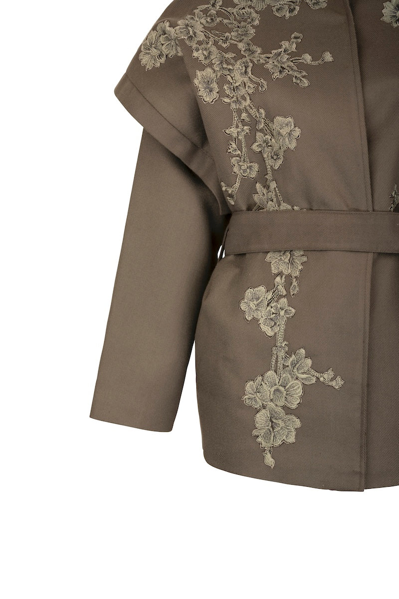 Nadya Shah Ash Bloom belted jacket shown from the side, featuring a stylish design and belt detail on a modern jacket.
