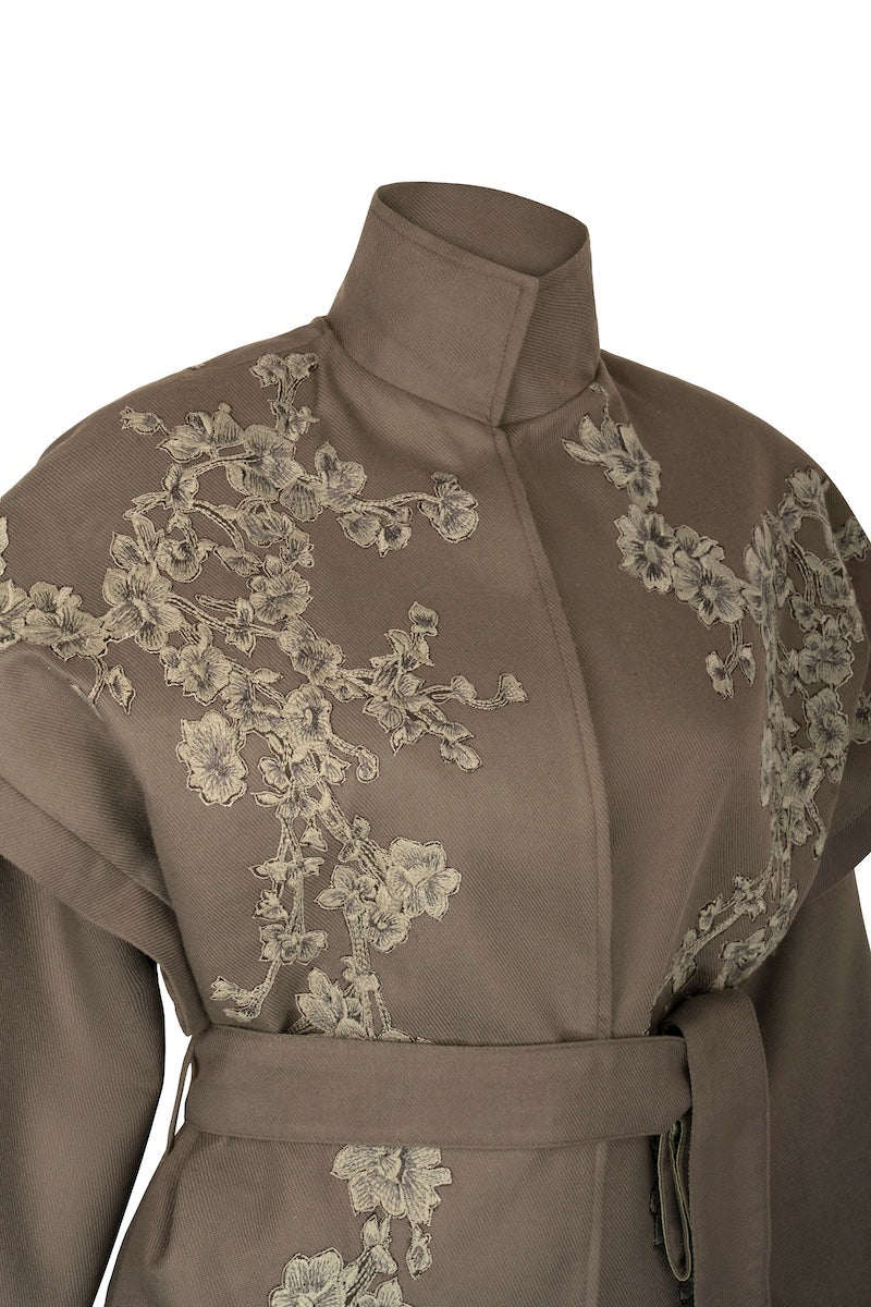 Nadya Shah Ash Bloom belted jacket with floral pattern, front view showing waist belt and tailored fit.