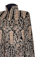 Nadya Shah Astrid Byzantine Cape jacket with intricate patterns and flowing fabric, displayed on a hanger.