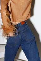 Dark blue Astra Feather denim jeans by Rayane Bacha featuring a relaxed fit and classic five-pocket style.
