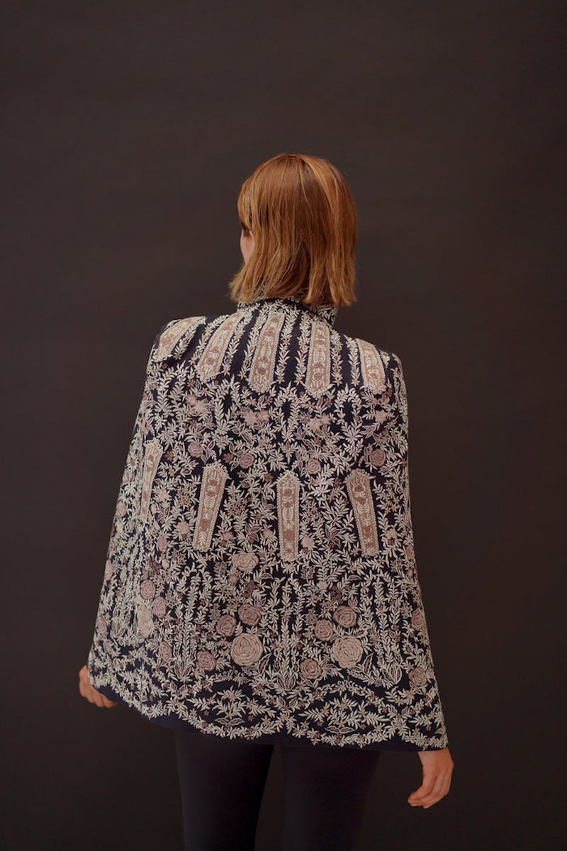 Nadya Shah Astrid Byzantine cape jacket shown from the back with intricate Byzantine-inspired design and flowing fabric.