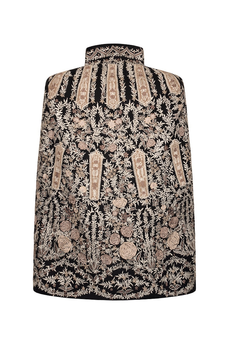 Nadya Shah Astrid in Byzantine cape jacket showing intricate back design and luxurious fabric details.