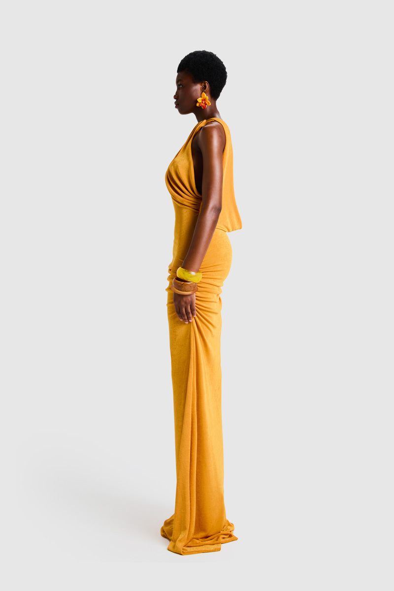 BBXBRAND asymmetric Niyah maxi dress in sweet pineapple print, flowing fabric with a stylish asymmetric hem detail.