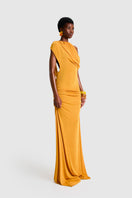 BBXBRAND asymmetrical Niyah maxi dress in sweet pineapple print, flowing fabric with unique hem and vibrant tropical colors.