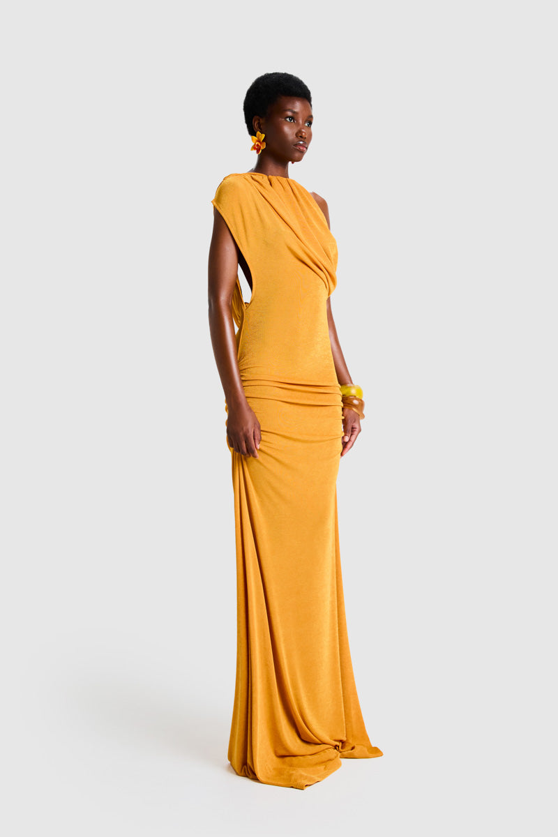 BBXBRAND asymmetrical Niyah maxi dress in sweet pineapple print, flowing fabric with unique hem and vibrant tropical colors.