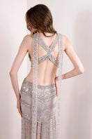 Rayane Bacha Athéa Gown in silver, elegant floor-length gown with intricate detailing and flowing fabric.