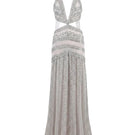 Rayane Bacha Athéa Gown in silver, elegant evening gown with intricate details, flowing fabric, and sophisticated design.