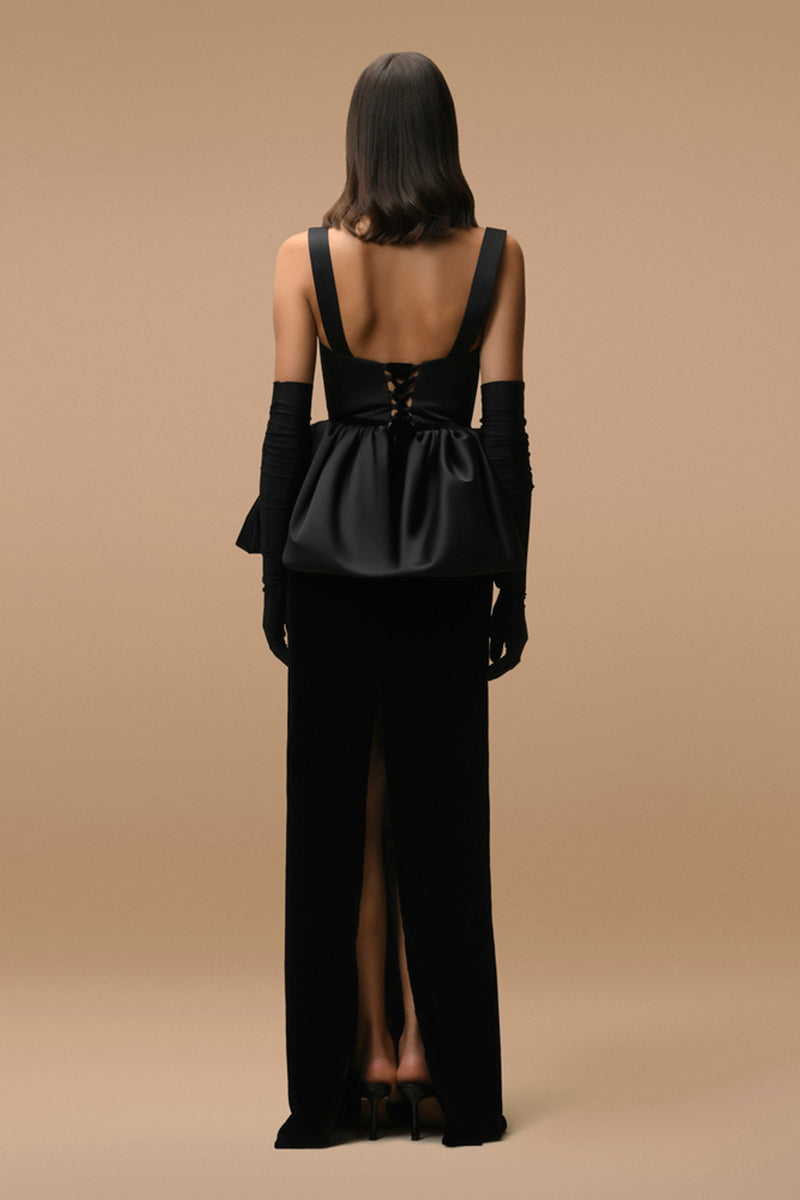 Black AUDREY dress by MATTERS, a stylish maxi dress with a flowing silhouette, displayed on a hanger against a neutral background.