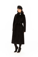 Nana Jacqueline Audrey coat in black, long stylish coat with tailored fit, displayed on a model in a lookbook setting.