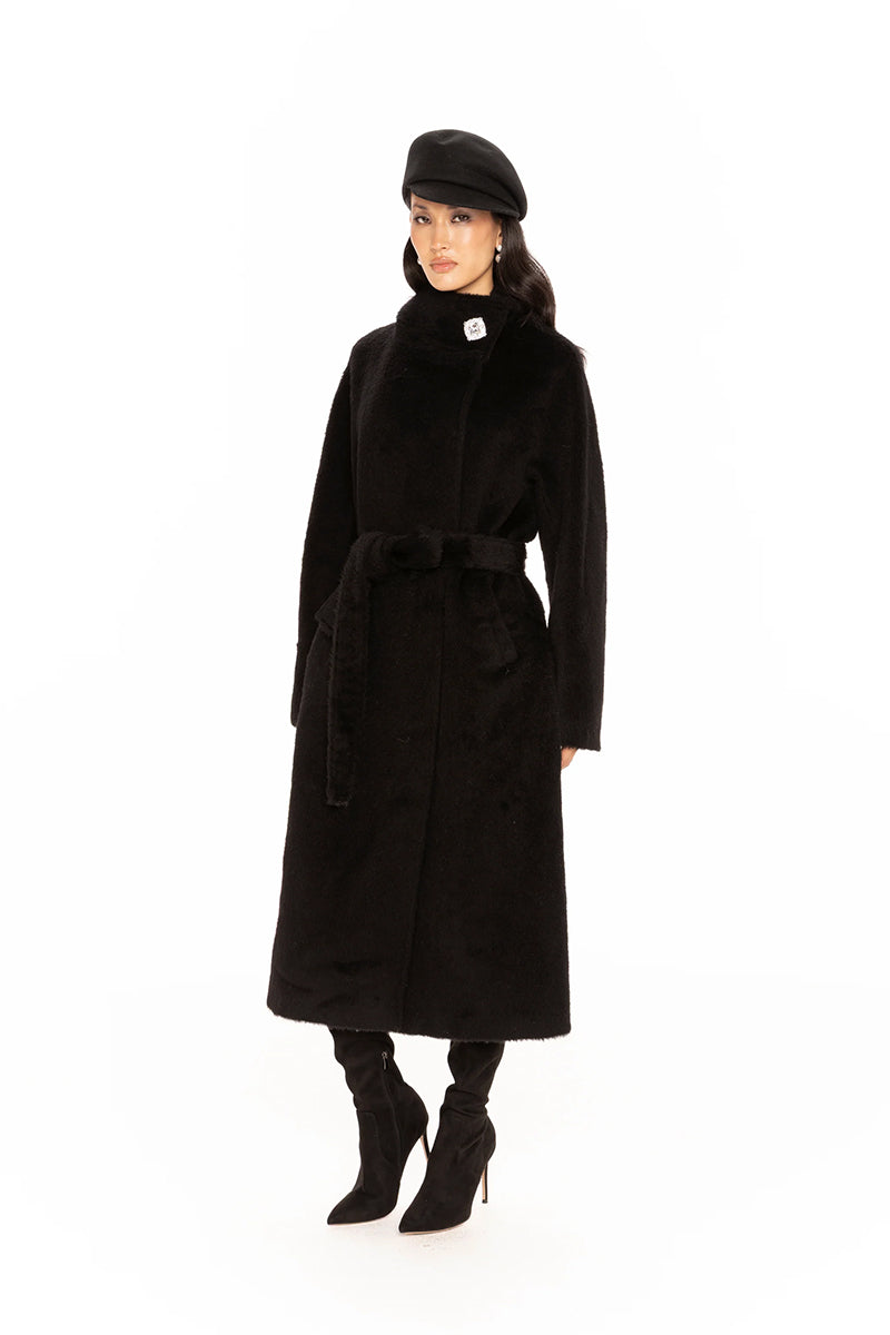 Nana Jacqueline Audrey coat in black, long stylish coat with tailored fit, displayed on a model in a lookbook setting.
