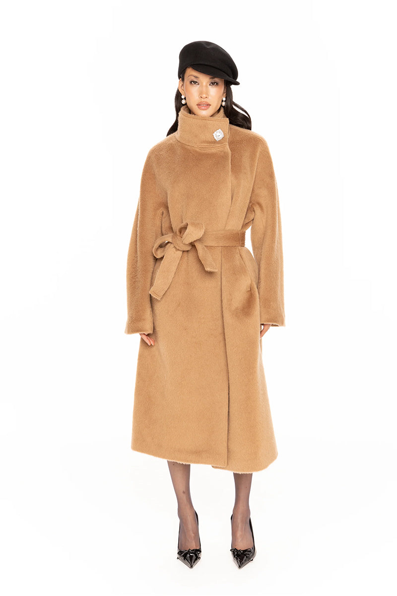 Nana Jacqueline Audrey camel coat shown on a model, long style with tailored fit, featuring classic lapels and warm camel color.