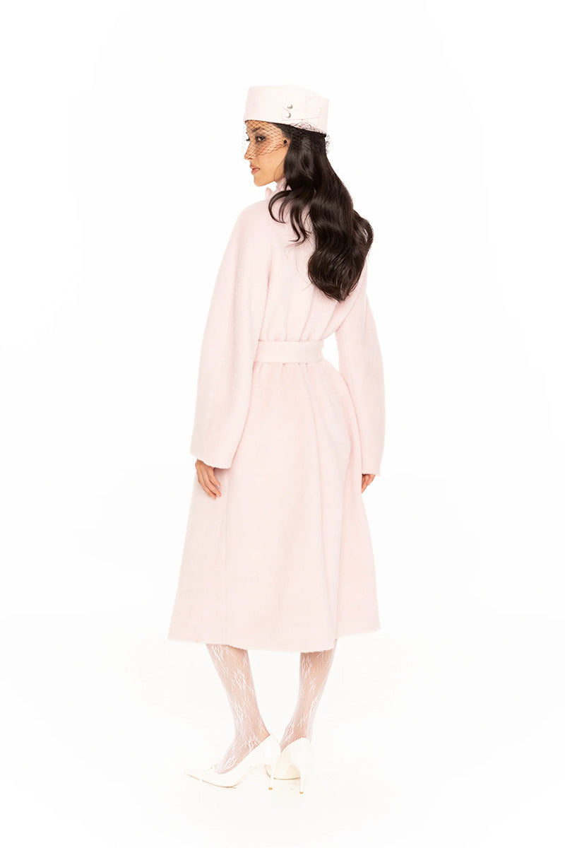 Nana Jacqueline Audrey pink long coat displayed on a model, showcasing elegant winter outerwear with a tailored fit and soft fabric.
