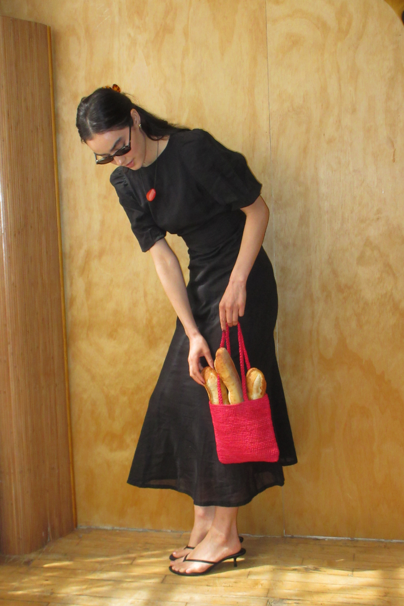Black Aurelia maxi dress by Summer Away, flowing fabric with a stylish silhouette, perfect for elegant summer occasions.
