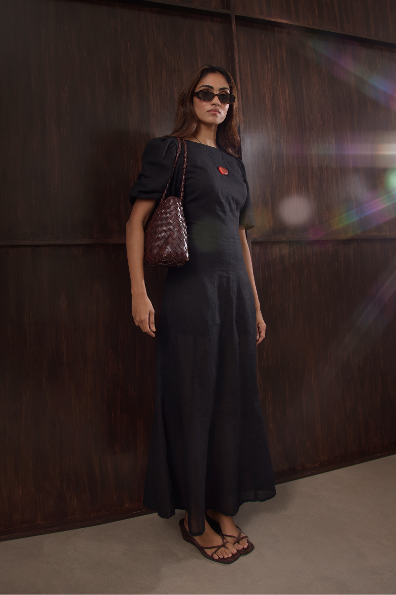 Black Aurelia maxi dress by Summer Away featuring flowing fabric and elegant design, perfect for stylish summer looks.