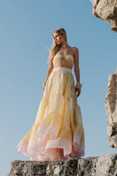 Gigii's Aurora Gialla co-ord set featuring a stylish bandeau top and matching skirt in vibrant yellow fabric.