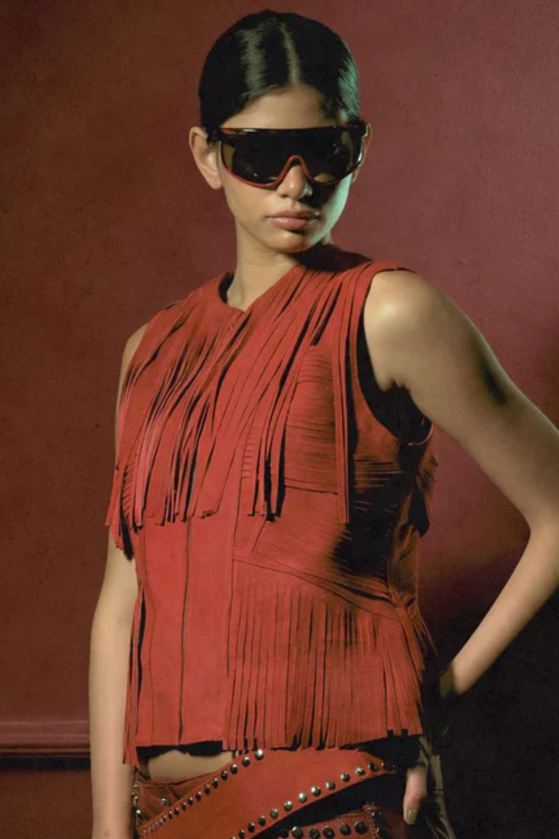 Red AURORA suede vest by Double A, shown on a hanger, featuring a soft suede texture and stylish sleeveless design.