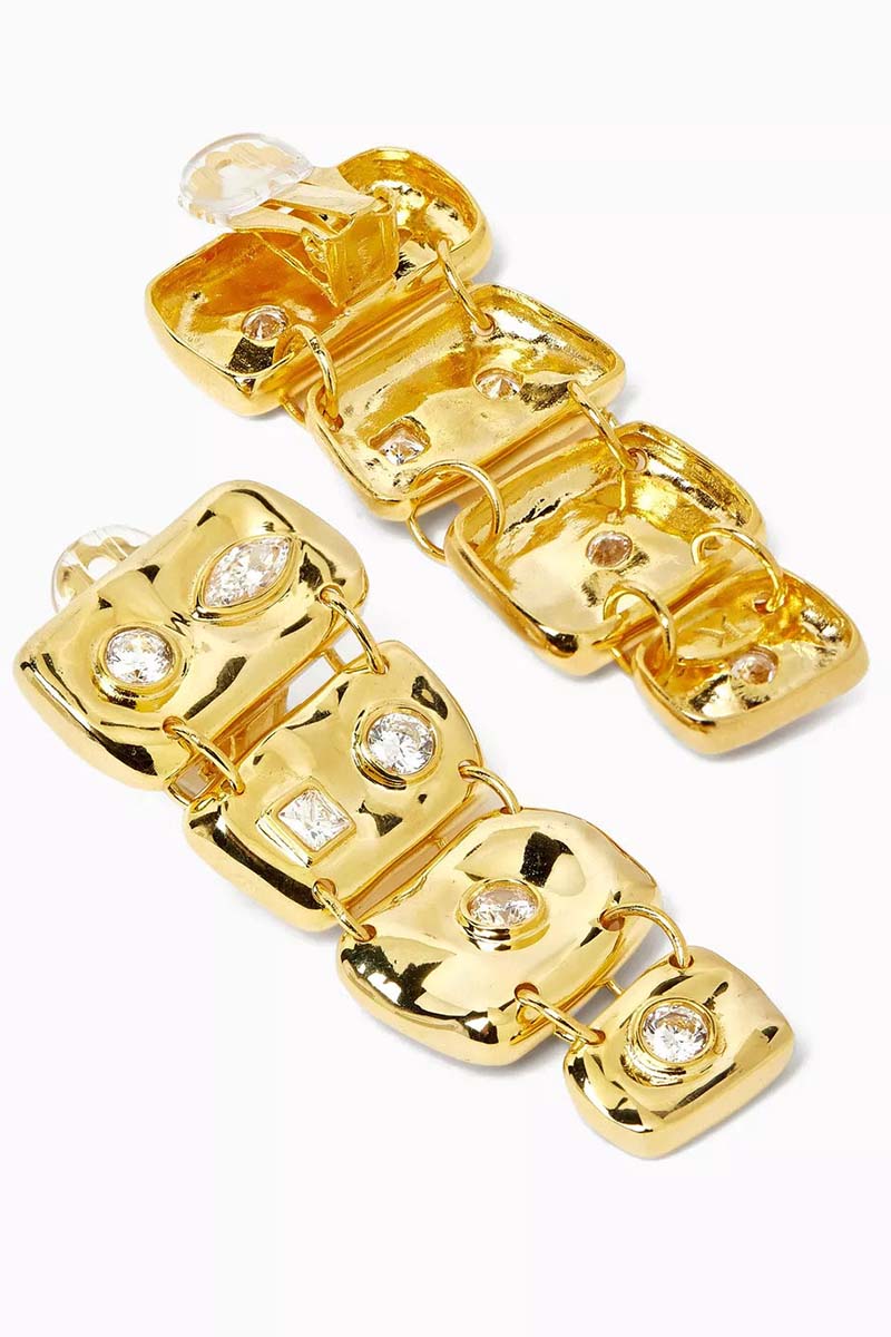 Jessica K B.O MINI AURIS earrings featuring small, delicate hoop design with a sleek gold finish on a white background.