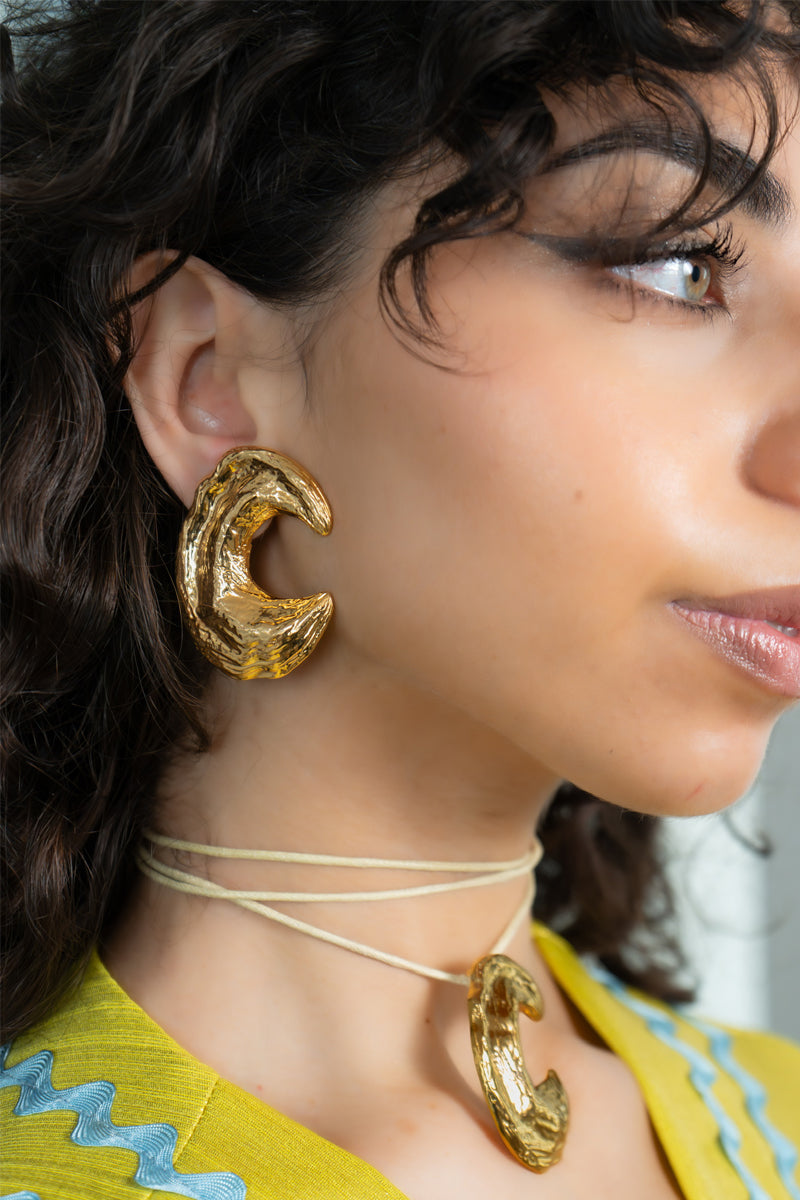 Jessica K B.O Demi earrings featuring elegant, lightweight design with polished metal and subtle detailing.
