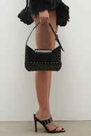 JC Pajares NAHI wicker and leather top handle bag with woven wicker body and leather accents, stylish and versatile accessory.