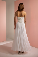 Joanna Andraos white corset top with matching palazzo trousers co-ord set, back view showing fitted bodice and wide-leg pants.