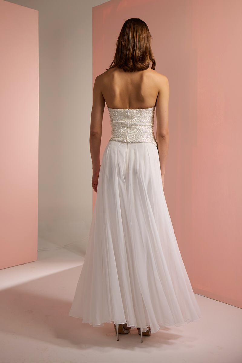 Joanna Andraos white corset top with matching palazzo trousers co-ord set, back view showing fitted bodice and wide-leg pants.