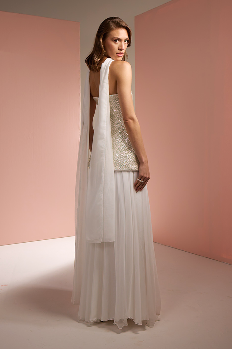 Joanna Andraos white strapless top and skirt co-ords set with matching scarf, shown from the back, stylish and elegant ensemble.