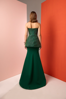 Joanna Andraos emerald corset top and skirt co-ord set shown from the back, featuring a fitted corset and matching skirt.