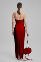 Elegant GIGI RADIANT RED gown by BAÉ, featuring flowing fabric and a stylish design, perfect for formal occasions.