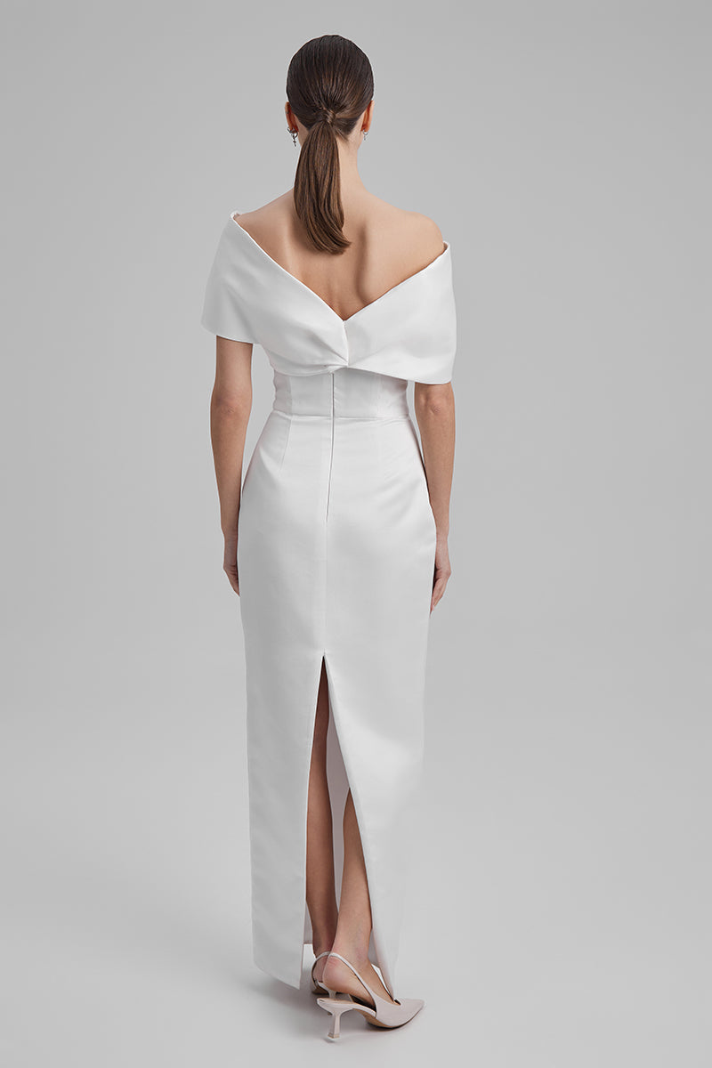 White maxi dress with shoulder bow from BAÉ, featuring flowing fabric and elegant design, perfect for summer or special occasions.