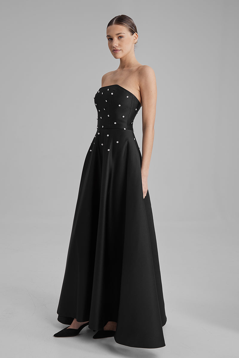 Black gown by BAÉ from the EVE DIAMONDS collection, featuring elegant fabric and intricate design details.