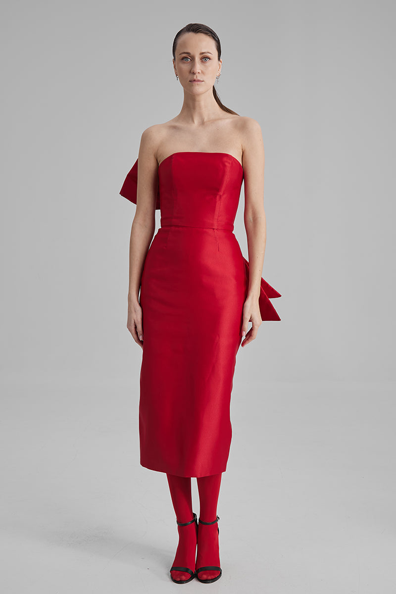 Red BAÉ KIRA midi dress with side bow, showcasing the elegant design and flowy fabric of this stylish midi dress.