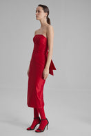 Red KIRA midi dress by BAÉ featuring a side bow, elegant midi-length design, perfect for stylish occasions.