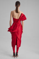 Red KIRA midi dress with a side bow by BAÉ, featuring a stylish, elegant design and a flattering fit.
