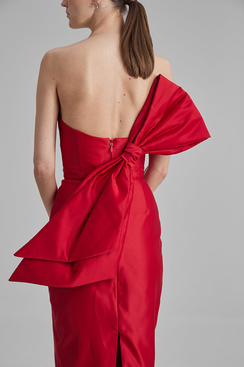 Red midi dress with a side bow from BAÉ, featuring a stylish and elegant design perfect for special occasions.
