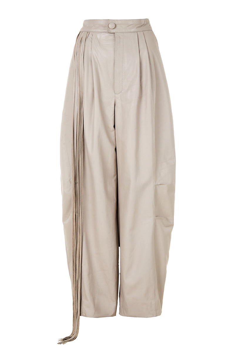 Ivory baggy leather fringe pants by MAZ Manuela Álvarez featuring relaxed fit and fringe detailing on the legs.