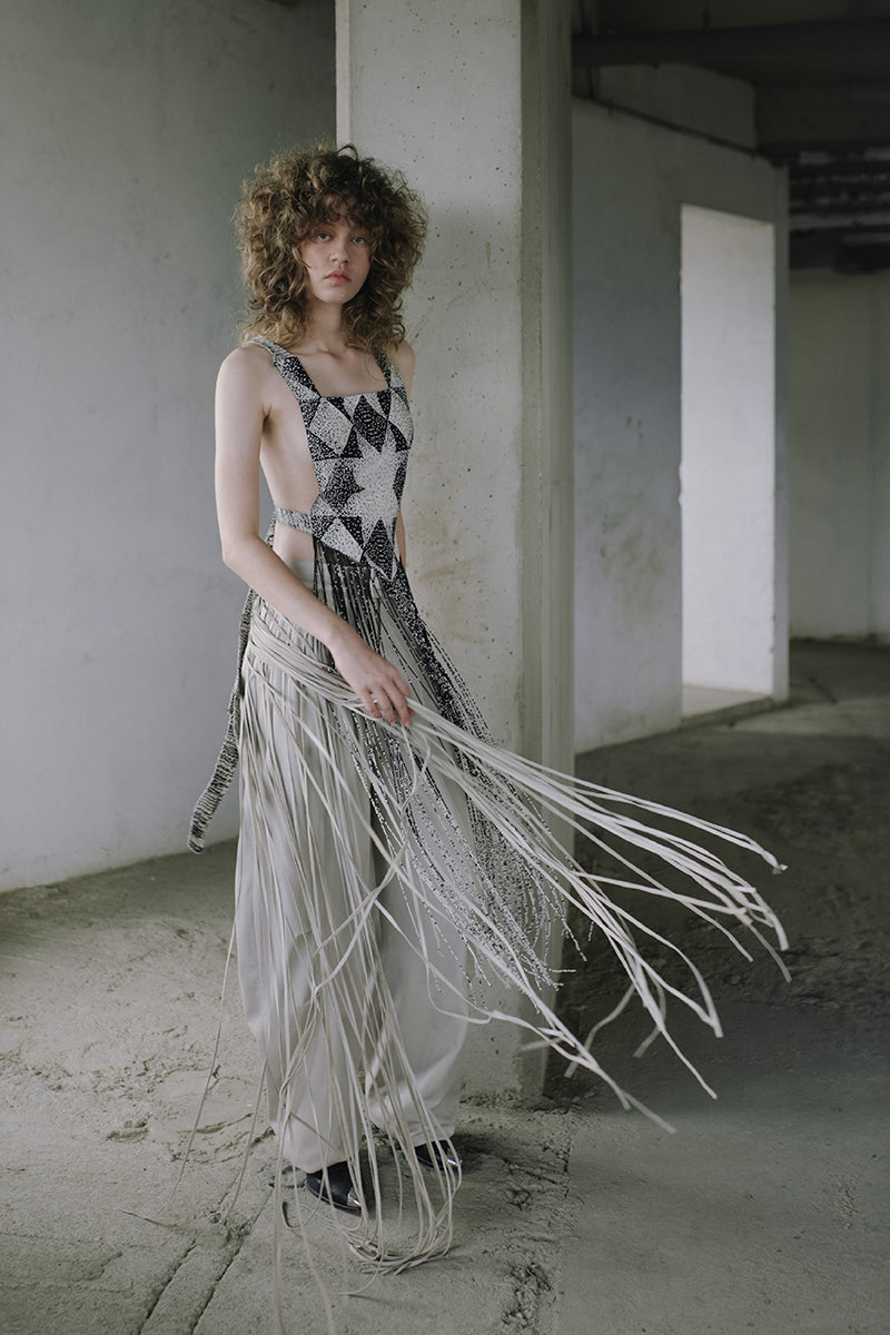 Ivory baggy leather fringe pants by MAZ Manuela Álvarez featuring relaxed fit and stylish fringe details.